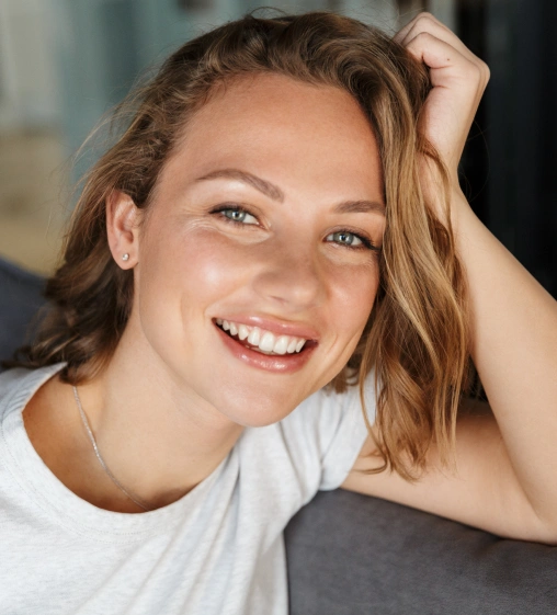 Patient smiling after receiving cosmetic treatment
