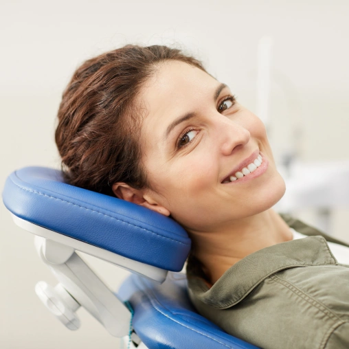 Patient receiving a routine dental exam and professional teeth cleaning
