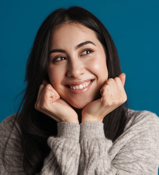 Smiling woman representing a patient after gum disease treatment.
