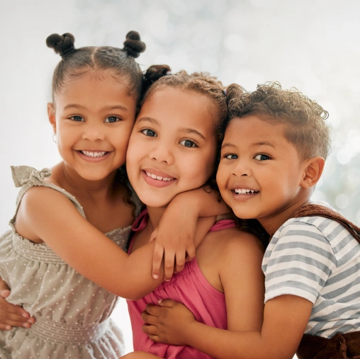 Children smiling during a positive and comfortable pediatric dental visit