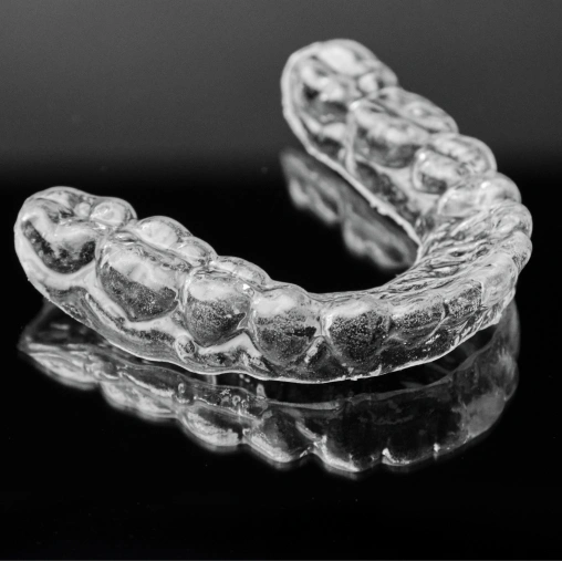 Custom night guard helping protect teeth from grinding and clenching while sleeping