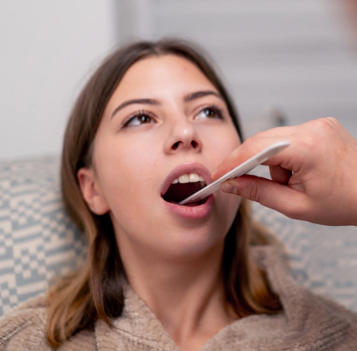 Patient receiving oral surgery evaluation in Colorado Springs CO