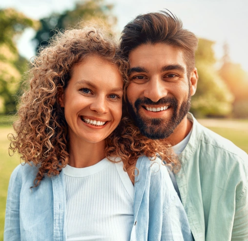 Smiling couple representing preventive dental care.
