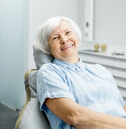 Smiling patient representing successful root canal therapy.