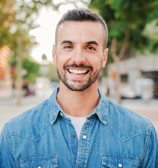 Smiling patient representing professional teeth whitening treatment.