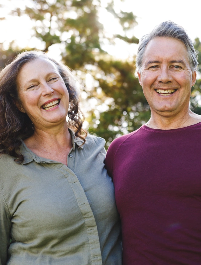 Happy adult couple smiling after dental treatment at Powers Dental Group, trusted family dentist in Colorado Springs